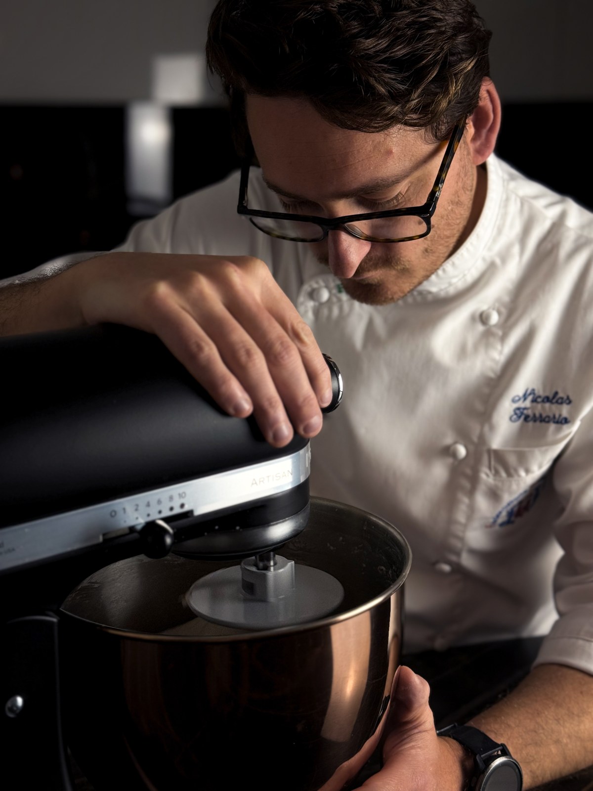 Private chef plating a bespoke dinner for a private dining experience on Lake Como